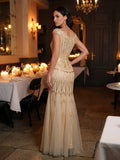 Karena Floor Length Dress Gold - Order In, showcasing a woman in an elegant, sequined gown at a candlelit dining setting.