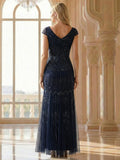 Karena Dress Navy Blue - Order In, showing cap sleeves, fitted design, and sequined details from the back view.