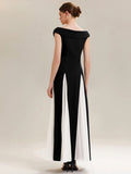 Back view of the Tonya Dress Black White - Order In, showcasing elegant cap sleeves and a flattering design.