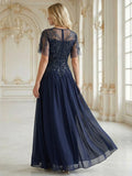 Whitney Dress Navy Blue - Order In featuring short sleeves, sequined top, and chiffon skirt, perfect for special occasions.