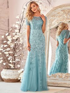 turkish blue formal dress with tulle overlay and leaf design