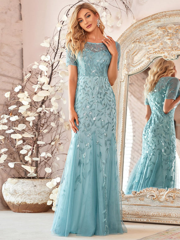 turkish blue formal dress with tulle overlay and leaf design
